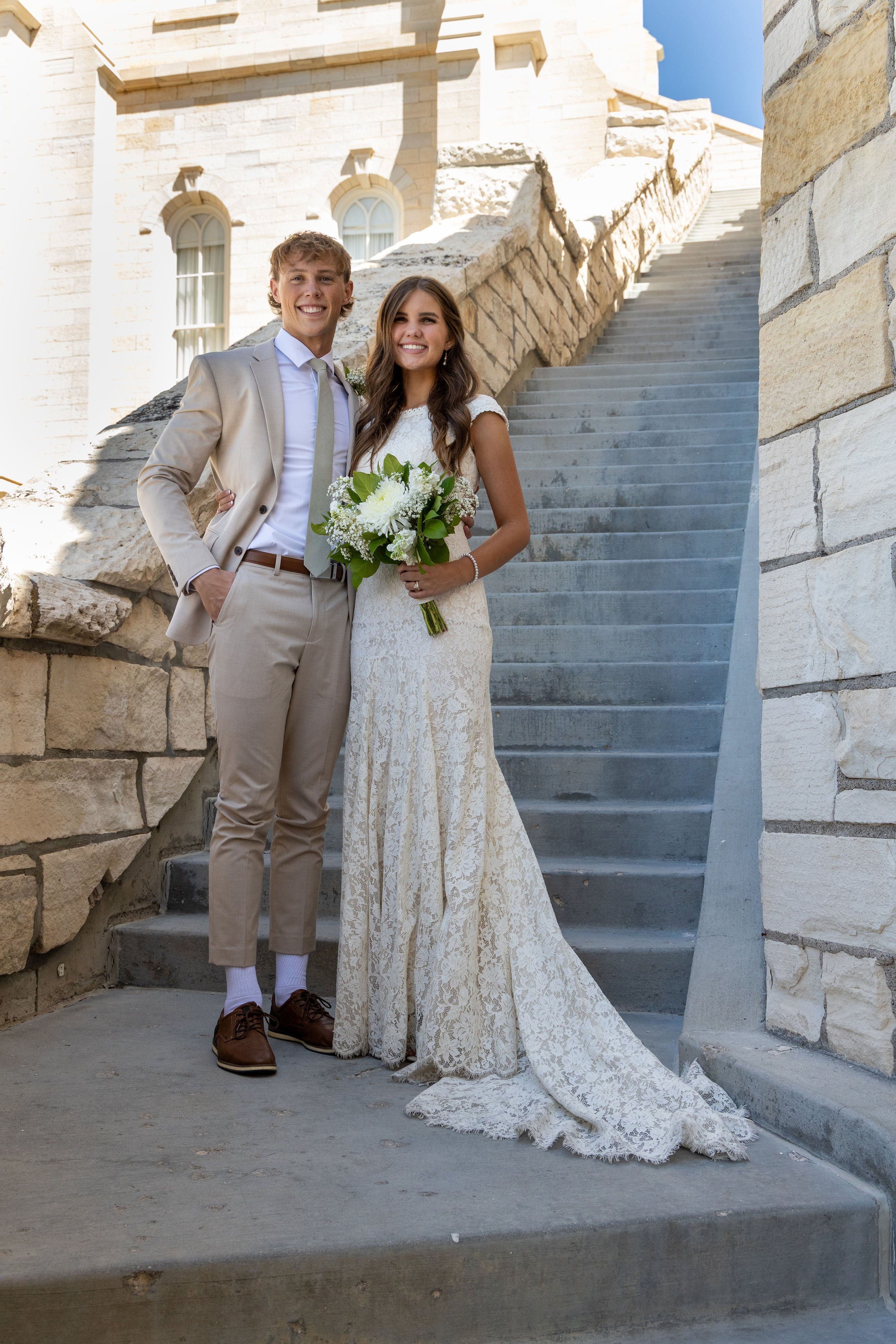 Trent and his partner standing together outdoors